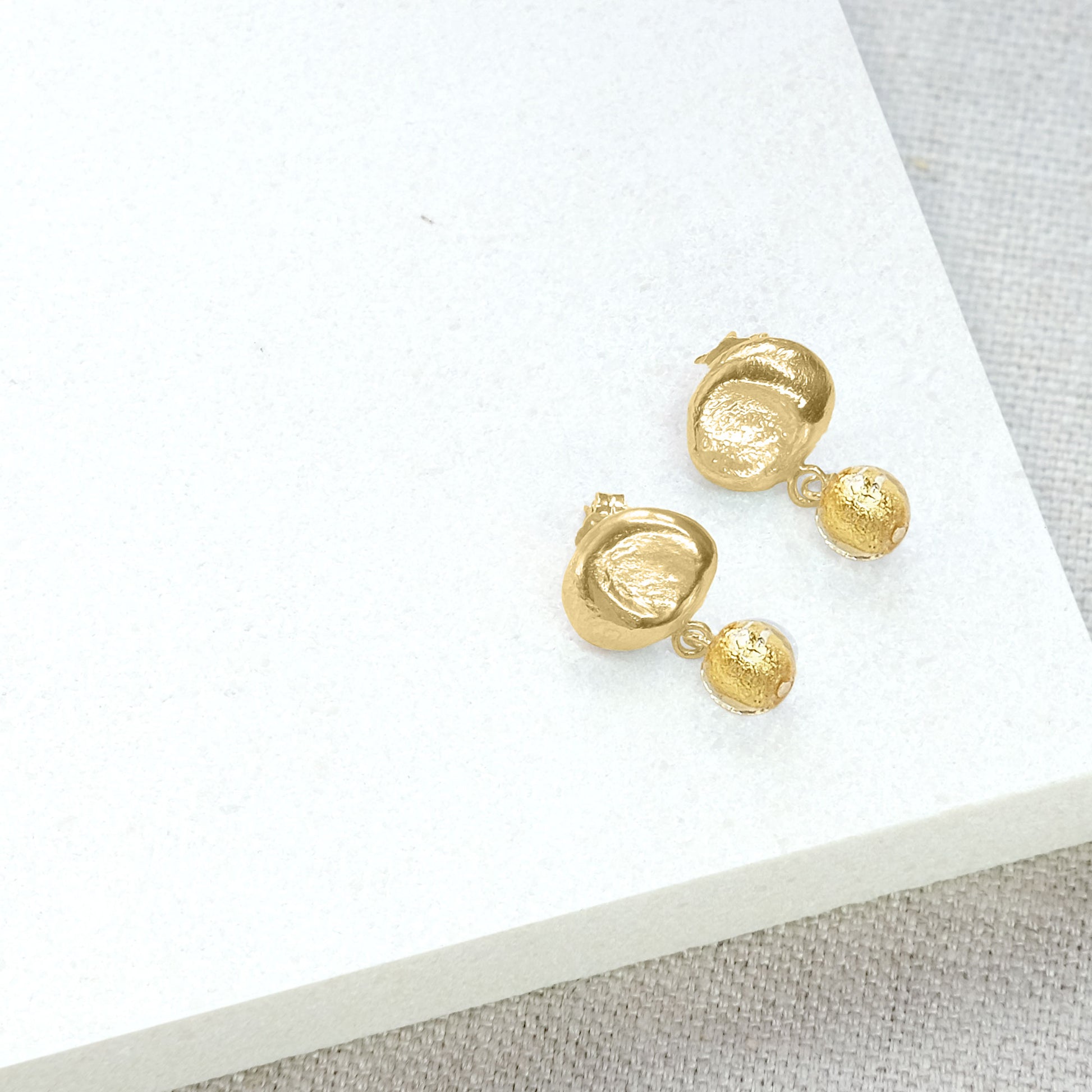 gold earrings with dangle